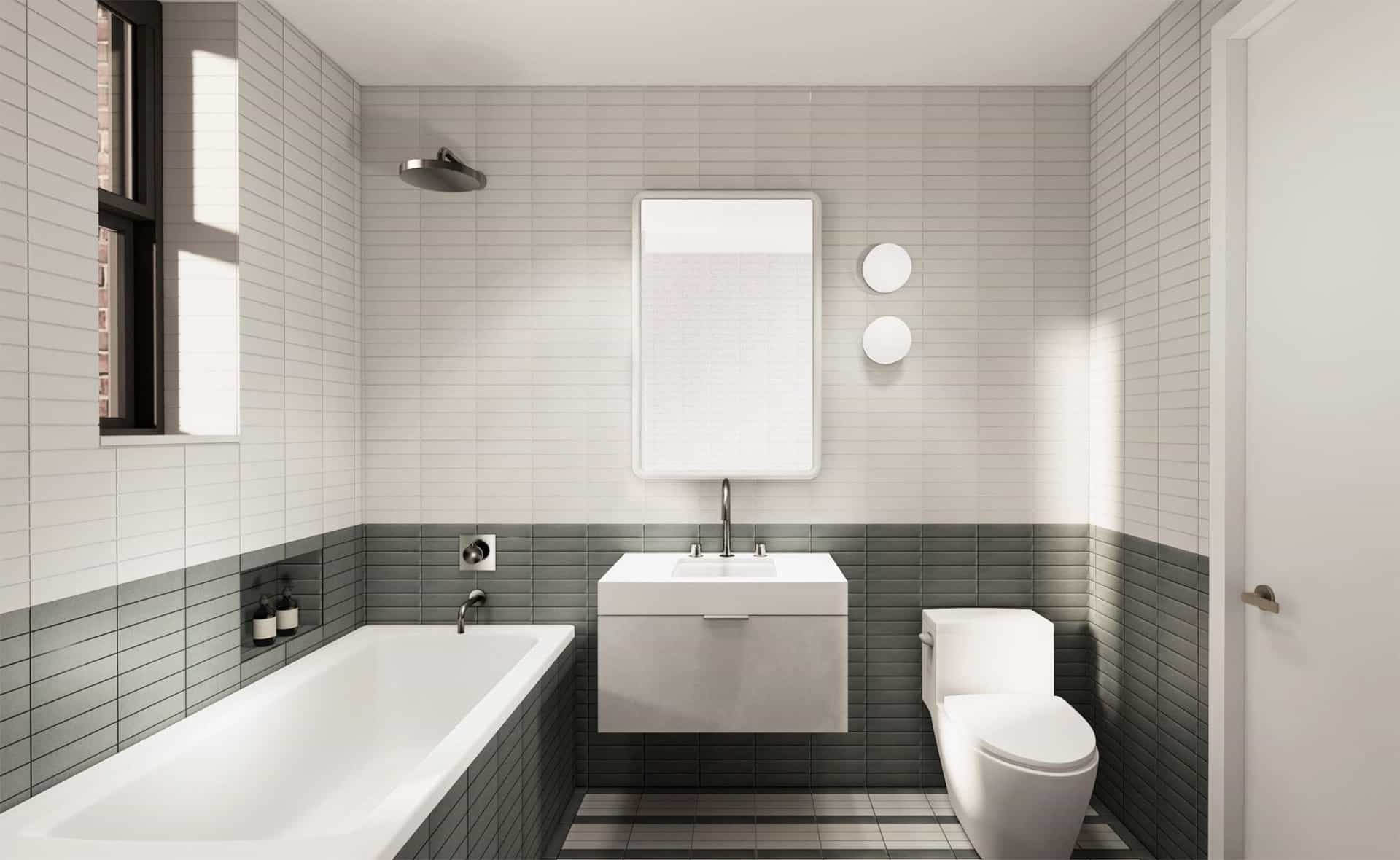 Bathroom at 229 West 20th Street apartments with tile floors and walls, a single vanity and soaking tub with a shower.