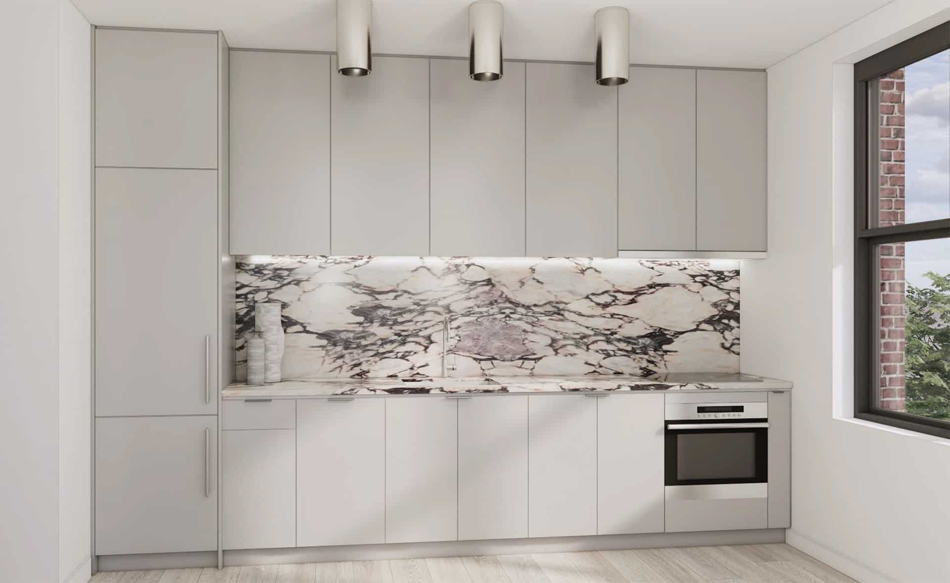 Kitchen at 229 West 20th Street apartments with Calacatta Viola marble countertops, stainless steel appliances & oak floors.